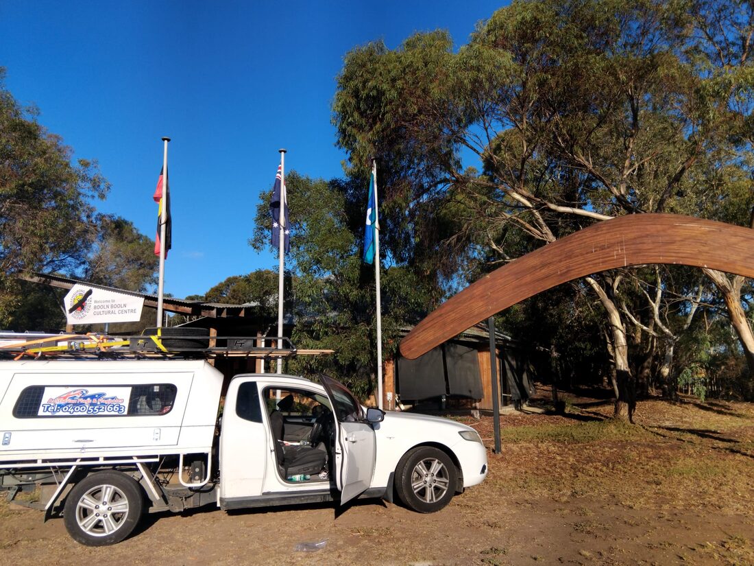 Three flagpoles installed outside a cultural centre