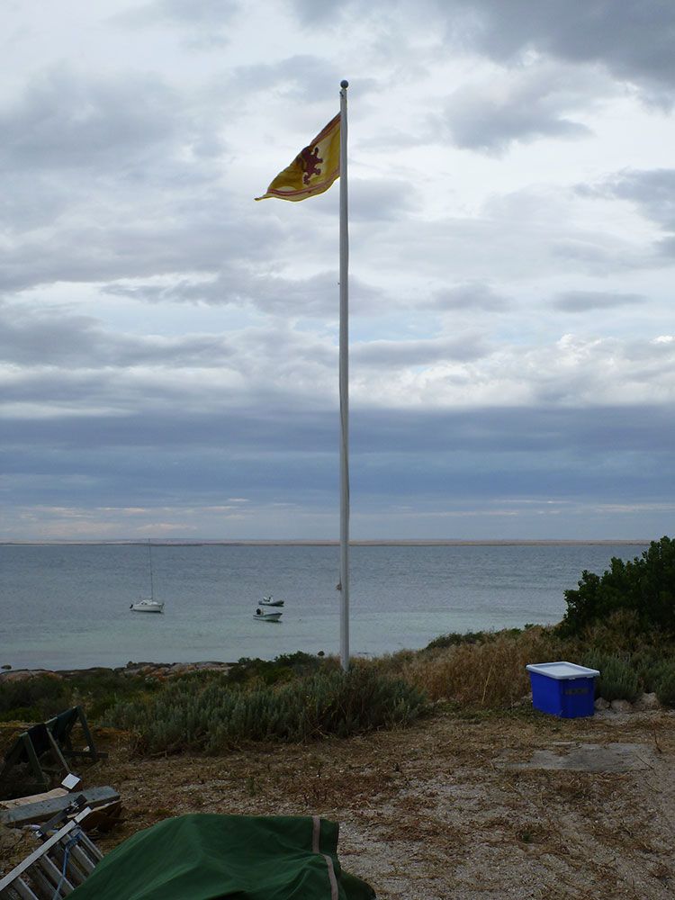 A commercial grade tapered flagpole on a coastal site